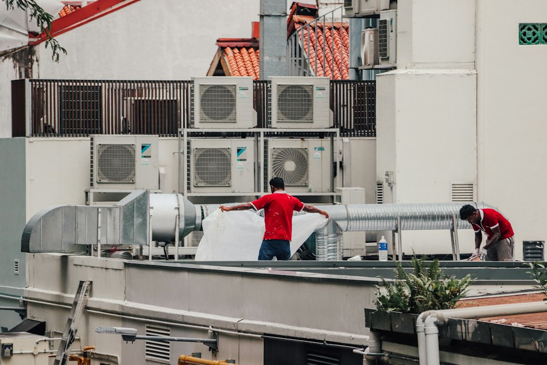 Technician carrying out heat-pump equipment maintenance