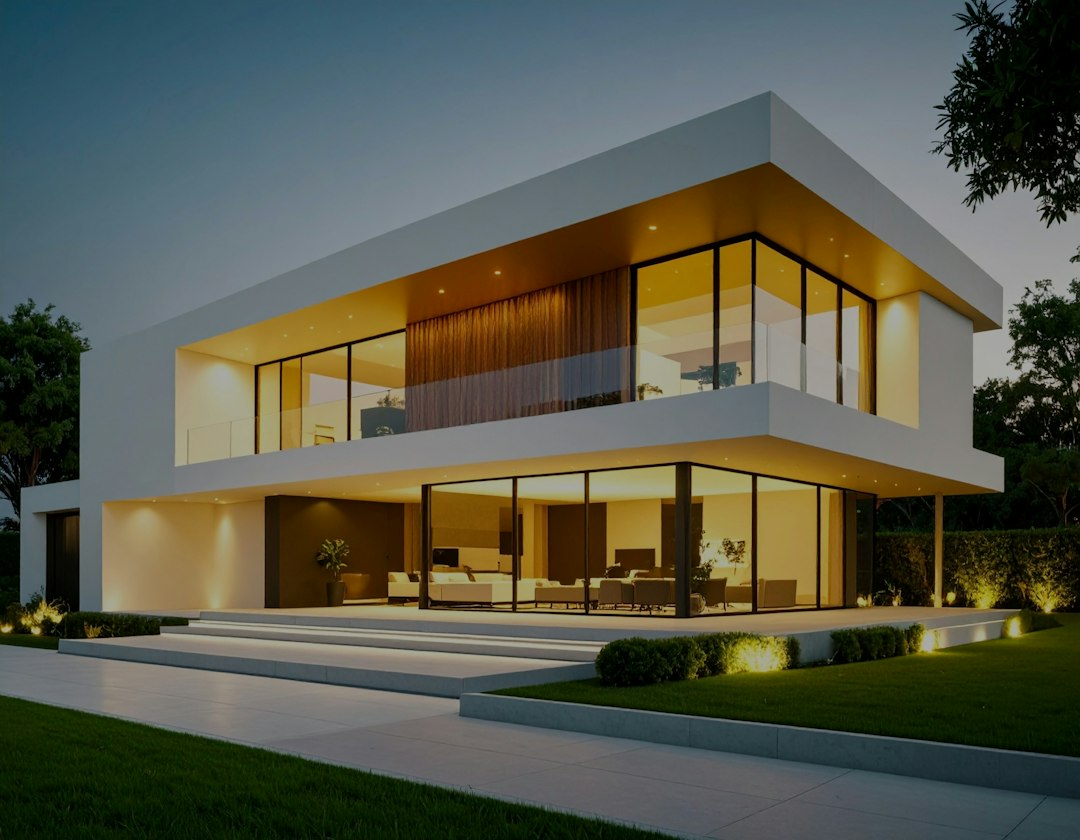 Modern home exterior illuminated by coordinated lighting